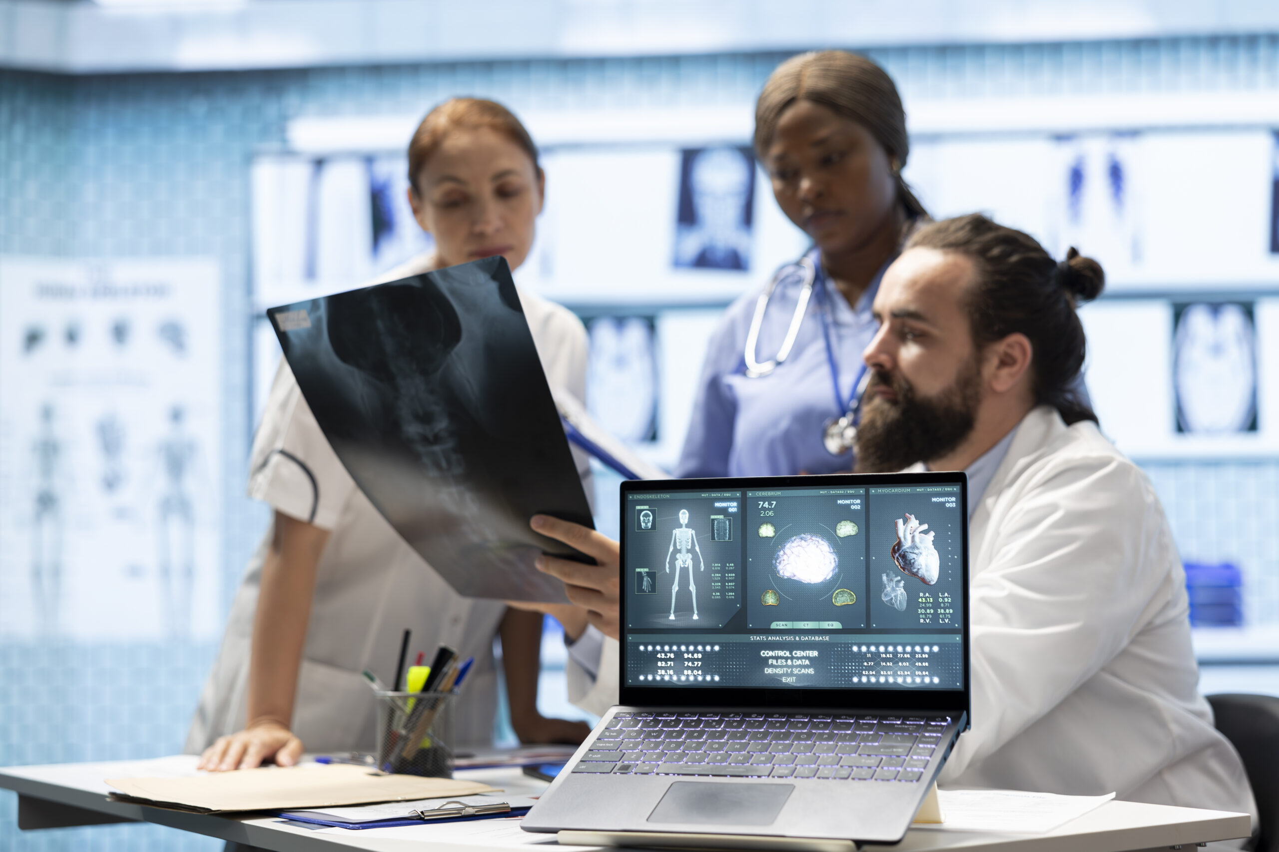 Medical professionals examine anatomy scans to develop effective treatment plan. Doctors doing teamwork to review analytics and find diagnosis and comprehensive healthcare solutions.